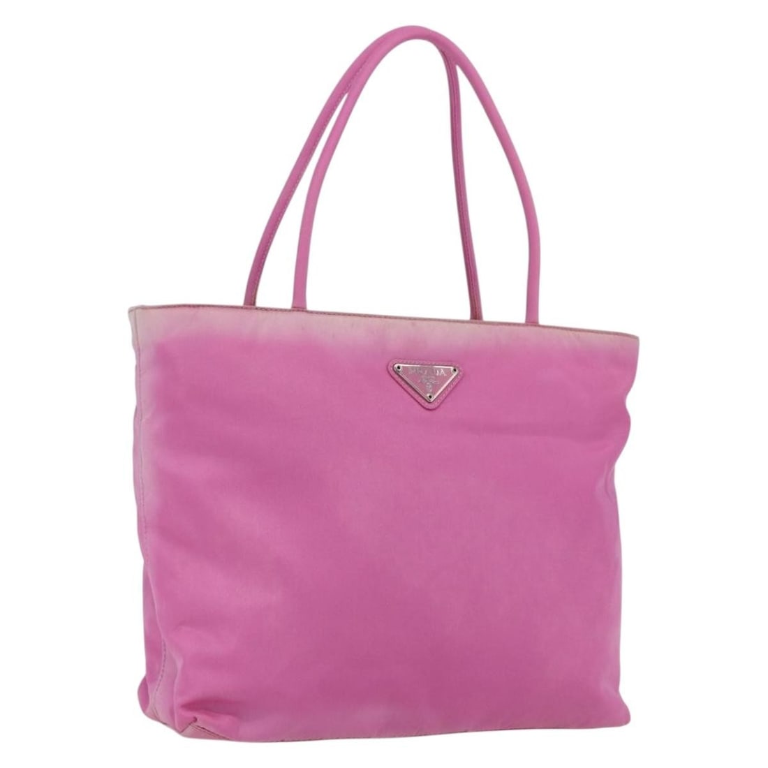 Pink Nylon Tote by PRADA with Silver Accents Made in Italy: Pink Nylon Tote by PRADA with Silver Accents Made in Italy This PRADA tote bag features a pink and silver nylon exterior with silver-tone accents. Designed with practicality in mind, it offers ample s