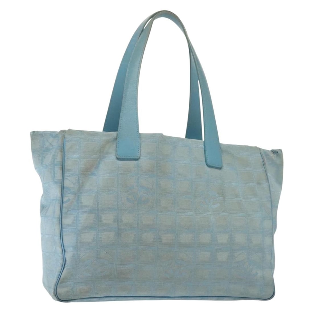 CHANEL New Travel Line Light Blue Nylon Tote Bag Auth: CHANEL New Travel Line Light Blue Nylon Tote Bag Auth This CHANEL New Travel Line Tote Bag is a stylish and functional accessory crafted from durable nylon in a light blue and silver color scheme. Des