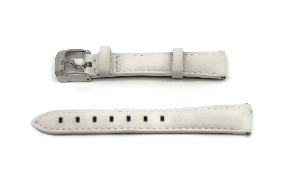 Authentic TAG Heuer White Leather Wristwatch Band 16mm: Authentic TAG Heuer White Leather Wristwatch Band 16mm Enhance your timepiece with this authentic Tag Heuer white leather wristwatch band. Crafted from genuine leather, this strap features a width of
