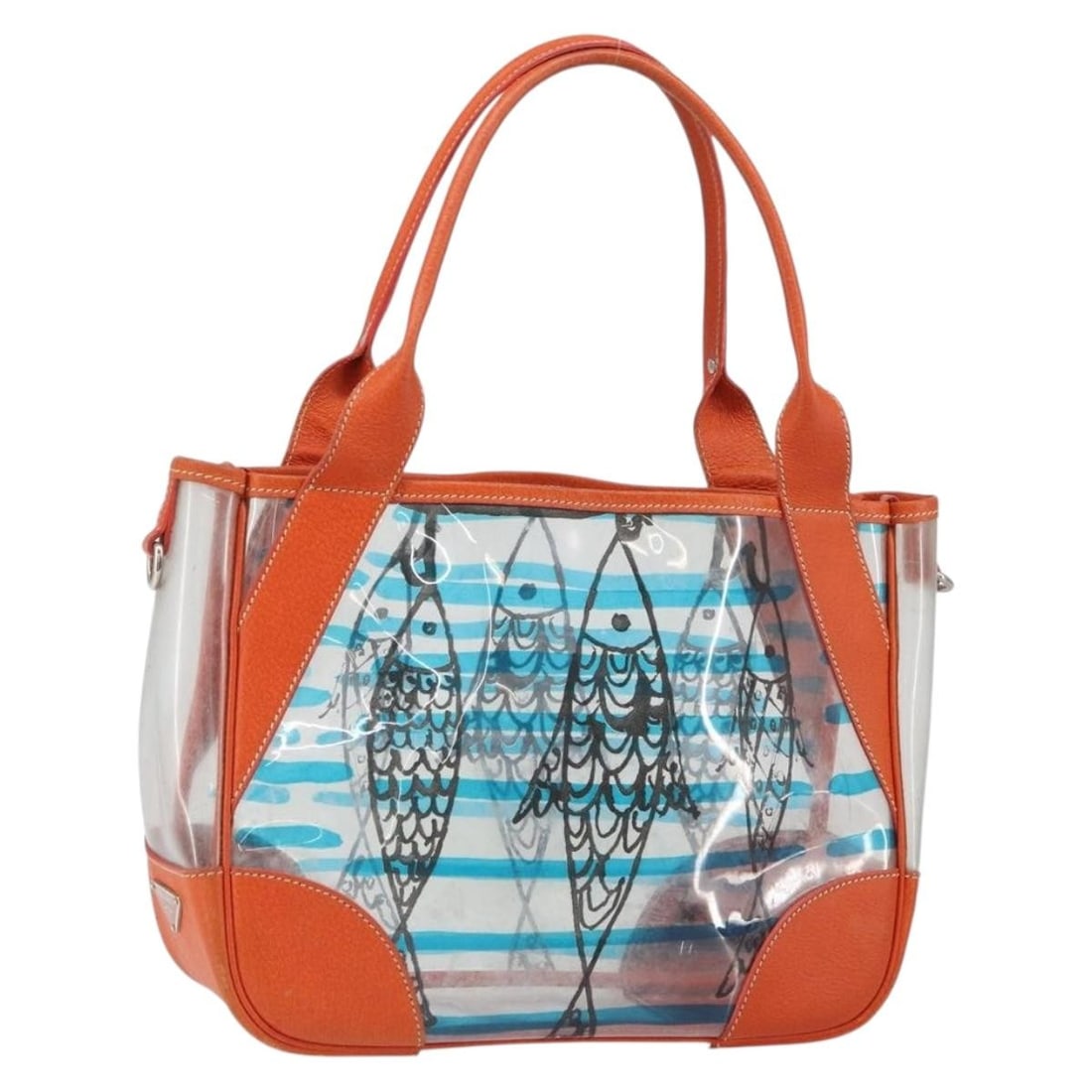 Prada Clear Silver Vinyl Tote Bag Made in Italy: Prada Clear Silver Vinyl Tote Bag Made in Italy This PRADA handbag features a clear and silver vinyl exterior with matching handles. Crafted in Italy, the bag offers a modern, transparent style. It is