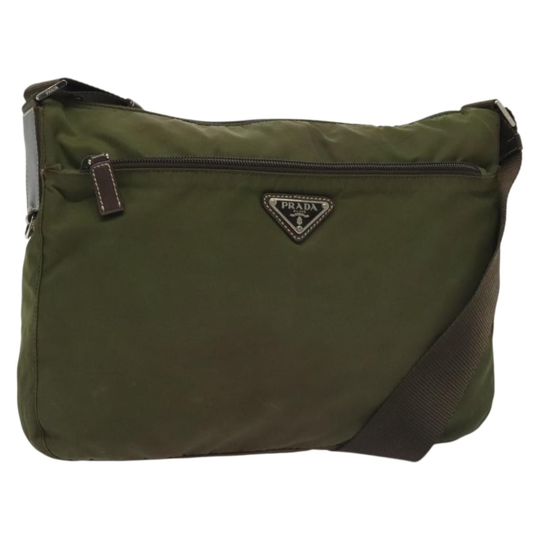 Authentic PRADA Khaki Silver Nylon Shoulder Bag Italy: Authentic PRADA Khaki Silver Nylon Shoulder Bag Italy This authentic PRADA shoulder bag is crafted from durable nylon in a stylish khaki and silver colorway. Measuring approximately 11.8 inches (30 cm