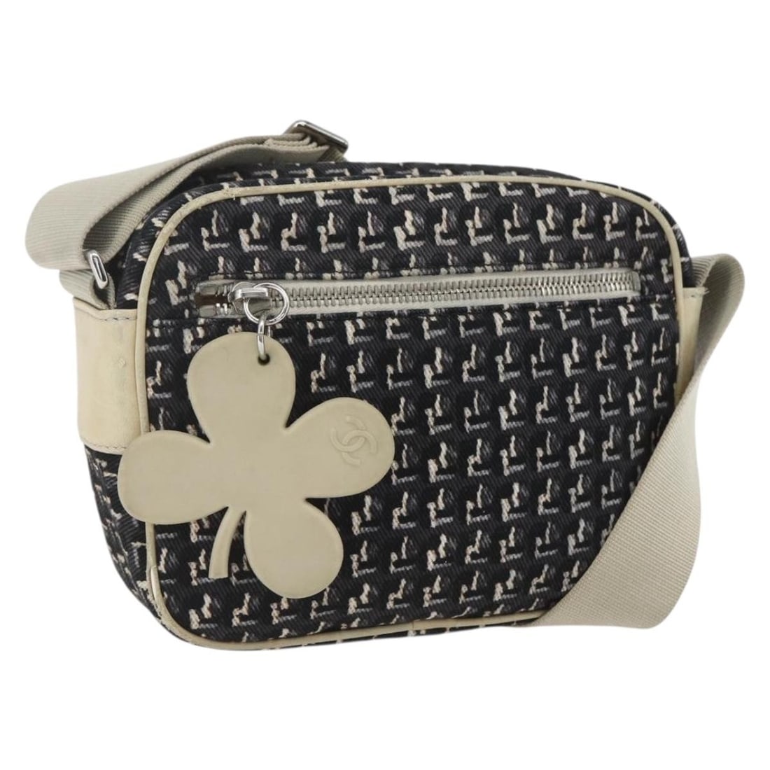 Black Silver Canvas Shoulder Bag by CHANEL Made in Italy: Black Silver Canvas Shoulder Bag by CHANEL Made in Italy This Chanel shoulder bag features a black and silver canvas exterior with the iconic CC logo. Made in Italy, it offers a compact size suitable