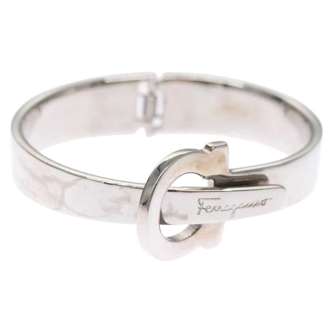 Salvatore Ferragamo Silver Gancini Bracelet Metal Authentic: Salvatore Ferragamo Silver Gancini Bracelet Metal Authentic Elevate your accessory collection with this exquisite Salvatore Ferragamo Gancini Bracelet. Crafted in Italy, this bracelet features a sleek