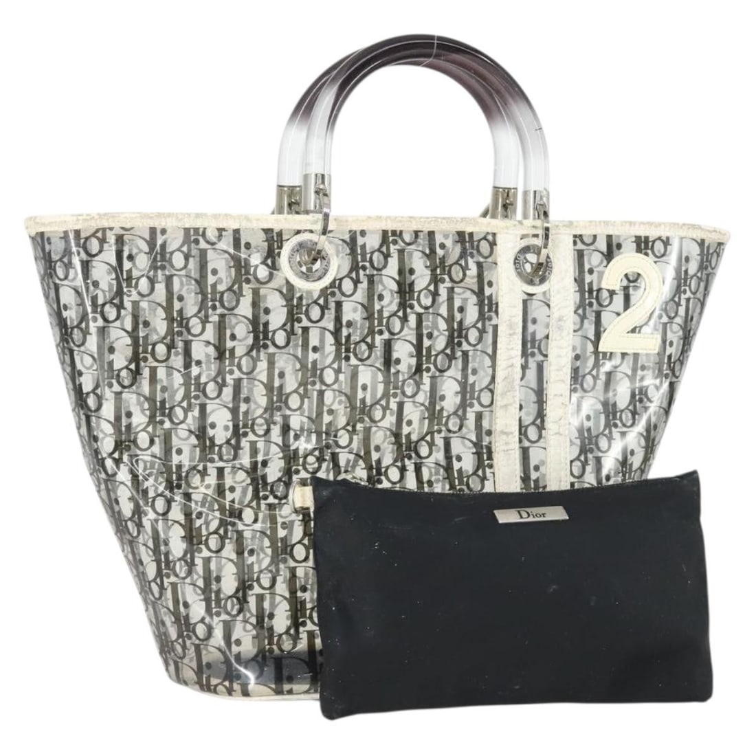 Clear Silver Vinyl Trotter Canvas Christian Dior Handbag with Pouch: Clear Silver Vinyl Trotter Canvas Christian Dior Handbag with Pouch This Christian Dior Trotter Canvas and Vinyl hand bag features a clear and silver exterior, complemented by a matching pouch accesso