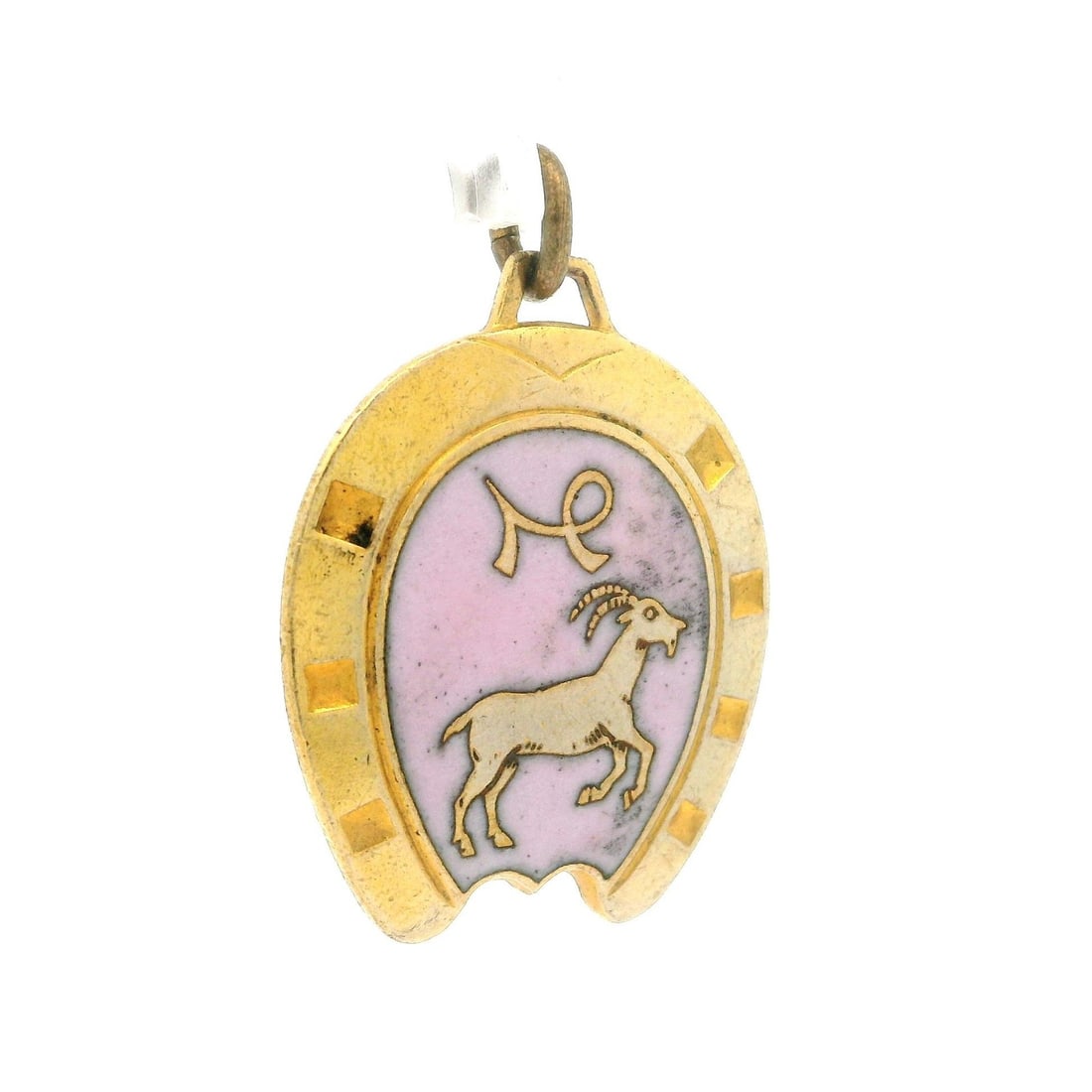 Vintage Zodiac Capricorn Gold Tone Pink Enamel Horseshoe Pendant: Vintage Zodiac Capricorn Gold Tone Pink Enamel Horseshoe Pendant This vintage pendant features a charming gold tone finish adorned with delicate pink enamel work, representing the Capricorn zodiac sig