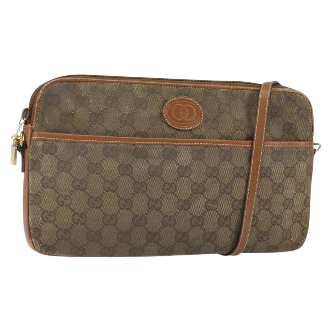 Brown Gold GG Canvas Shoulder Bag by Gucci Model 162101: Brown Gold GG Canvas Shoulder Bag by Gucci Model 162101 This GUCCI GG Canvas shoulder bag features a brown and gold color scheme with the signature GG canvas exterior. Made in Italy, the bag is design