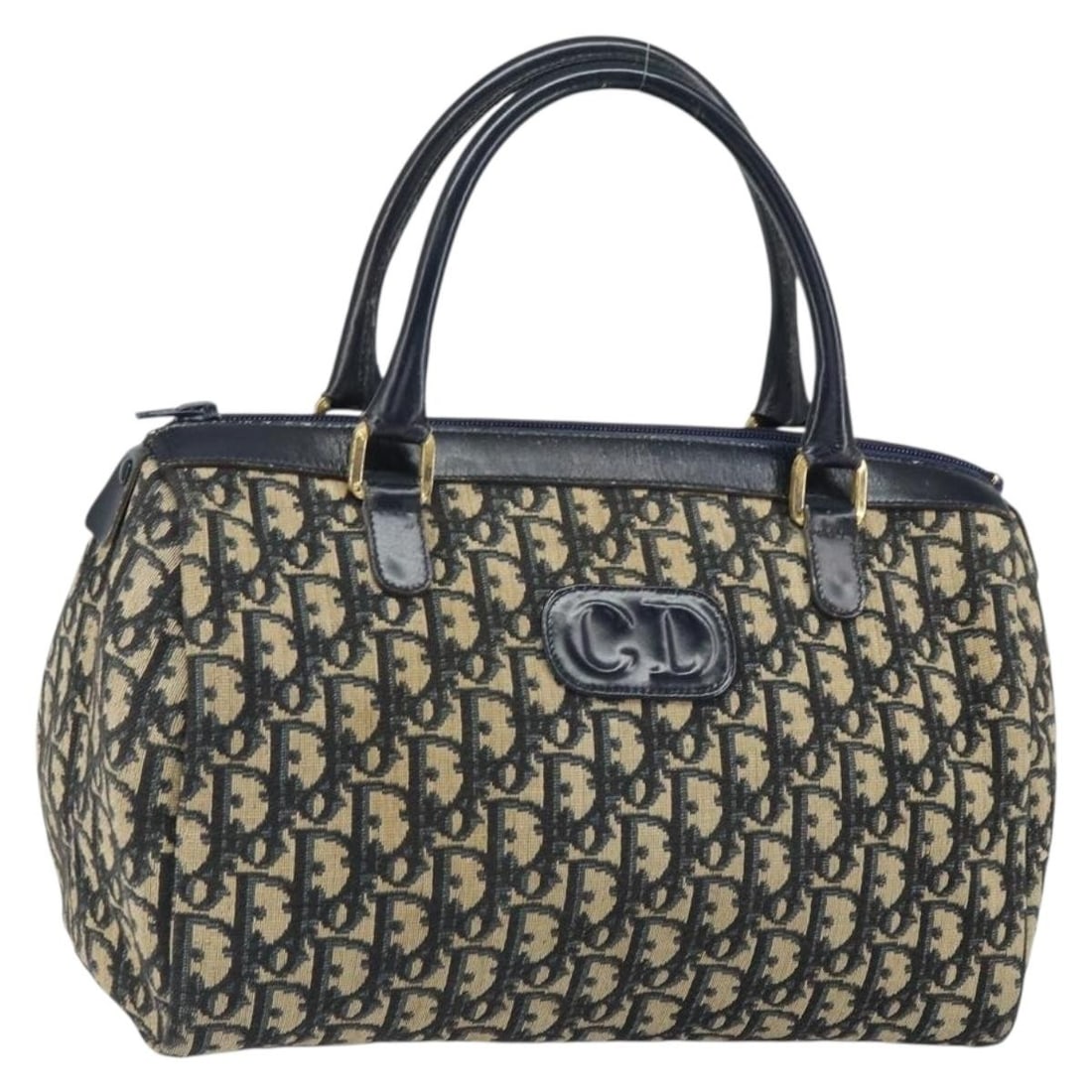Navy Gold Trotter Canvas Boston Bag by Christian Dior: Navy Gold Trotter Canvas Boston Bag by Christian Dior This Christian Dior Boston bag features navy trotter canvas with gold accents. It is crafted in France and showcases a classic Boston bag silhouet