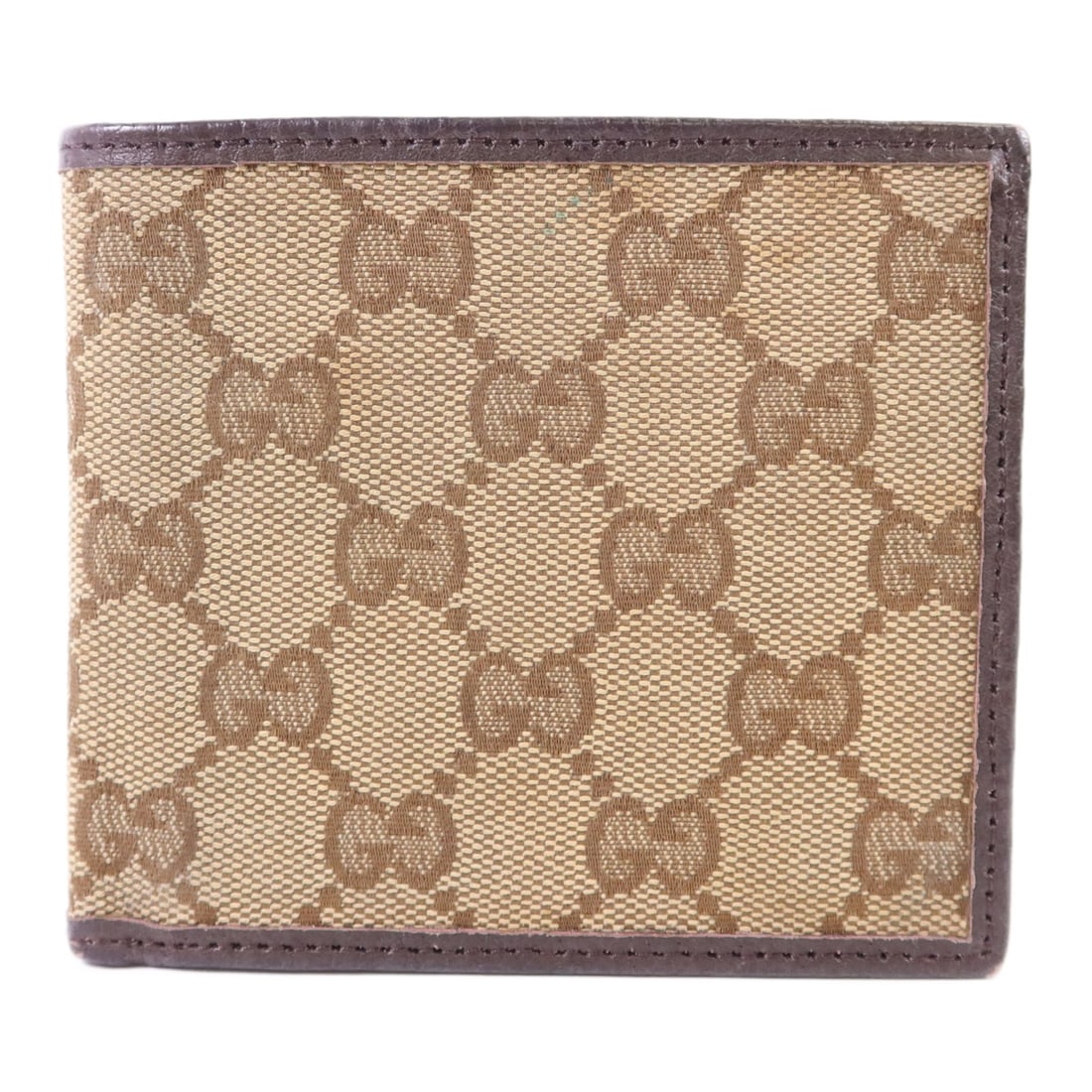 Brown GG Canvas Bi-fold Wallet from Gucci: Brown GG Canvas Bi-fold Wallet from Gucci This is a GUCCI GG bi-fold wallet crafted from brown GG canvas. It features a classic bi-fold design and is made in Italy. The wallet shows signs of heavy use