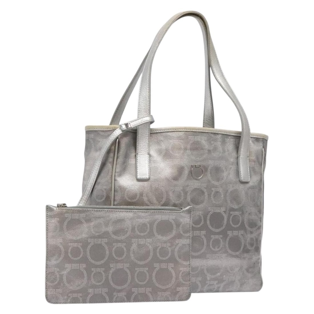 Salvatore Ferragamo Silver Leather Gancini Tote Bag Auth Italy: Salvatore Ferragamo Silver Leather Gancini Tote Bag Auth Italy Elevate your accessory collection with this chic Salvatore Ferragamo Gancini Tote Bag, crafted from high-quality leather in a striking si
