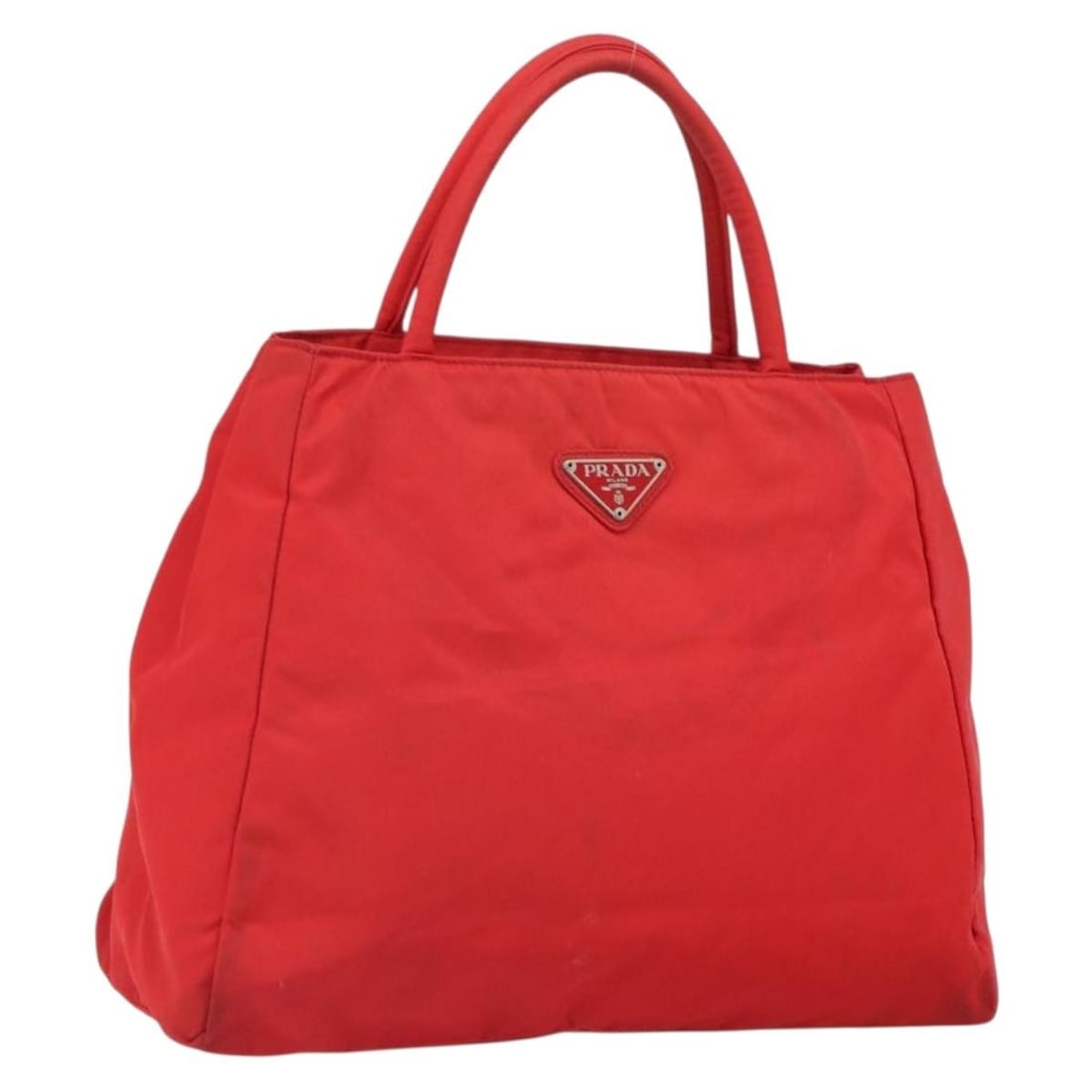 Red Nylon Prada Handbag with Guarantee Card and Italian Origin: Red Nylon Prada Handbag with Guarantee Card and Italian Origin This PRADA hand bag features a red nylon exterior and is crafted in Italy. It includes a guarantee card as an accessory. The bag shows si