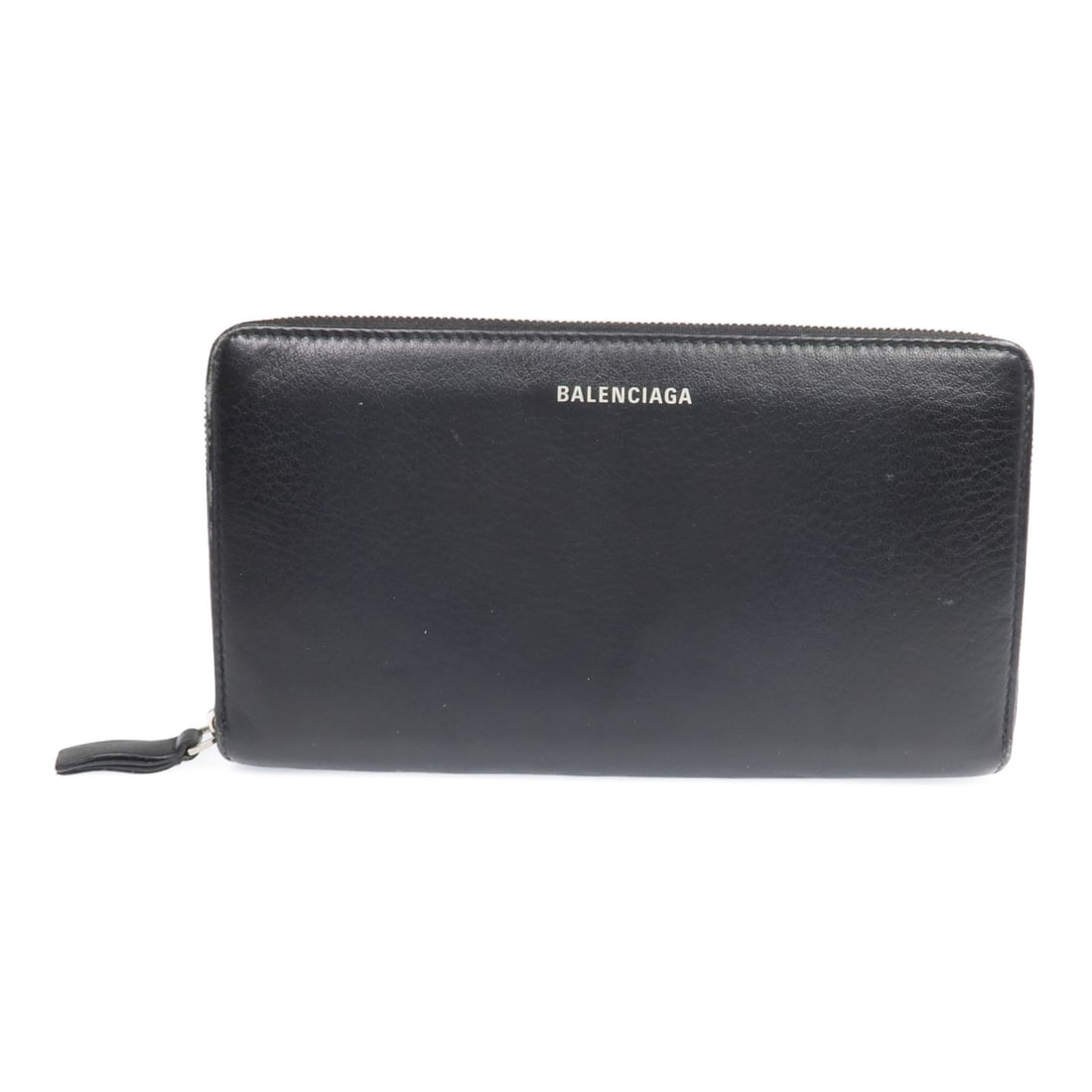 Black Calfskin Around Zip Long Wallet by Balenciaga with Silver Hardware: Black Calfskin Around Zip Long Wallet by Balenciaga with Silver Hardware This is a Balenciaga long wallet crafted from black calfskin leather. Designed in a classic around long wallet style, it featur