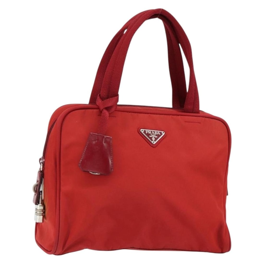 PRADA Red Nylon Hand Bag with Silver Accents Authentic: PRADA Red Nylon Hand Bag with Silver Accents Authentic This PRADA hand bag is a stylish blend of functionality and luxury, crafted in Italy from durable nylon. The bold red and silver color combinatio