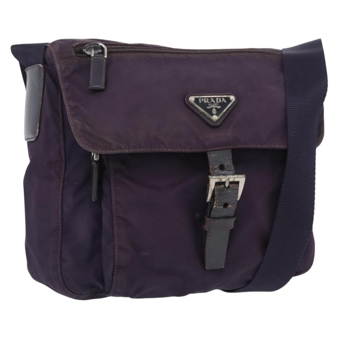 Purple Nylon PRADA Shoulder Bag with Silver Accents Made in Italy: Purple Nylon PRADA Shoulder Bag with Silver Accents Made in Italy This is a Prada shoulder bag crafted from purple nylon with silver-tone accents. The bag features an adjustable shoulder strap and is
