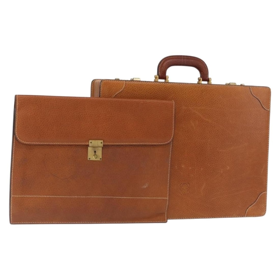 Brown Leather Handbag by LOEWE with Gold Accents Made in Italy: Brown Leather Handbag by LOEWE with Gold Accents Made in Italy This LOEWE attache case style handbag is crafted from brown leather with gold-tone accents. Made in Italy, the bag features a structured