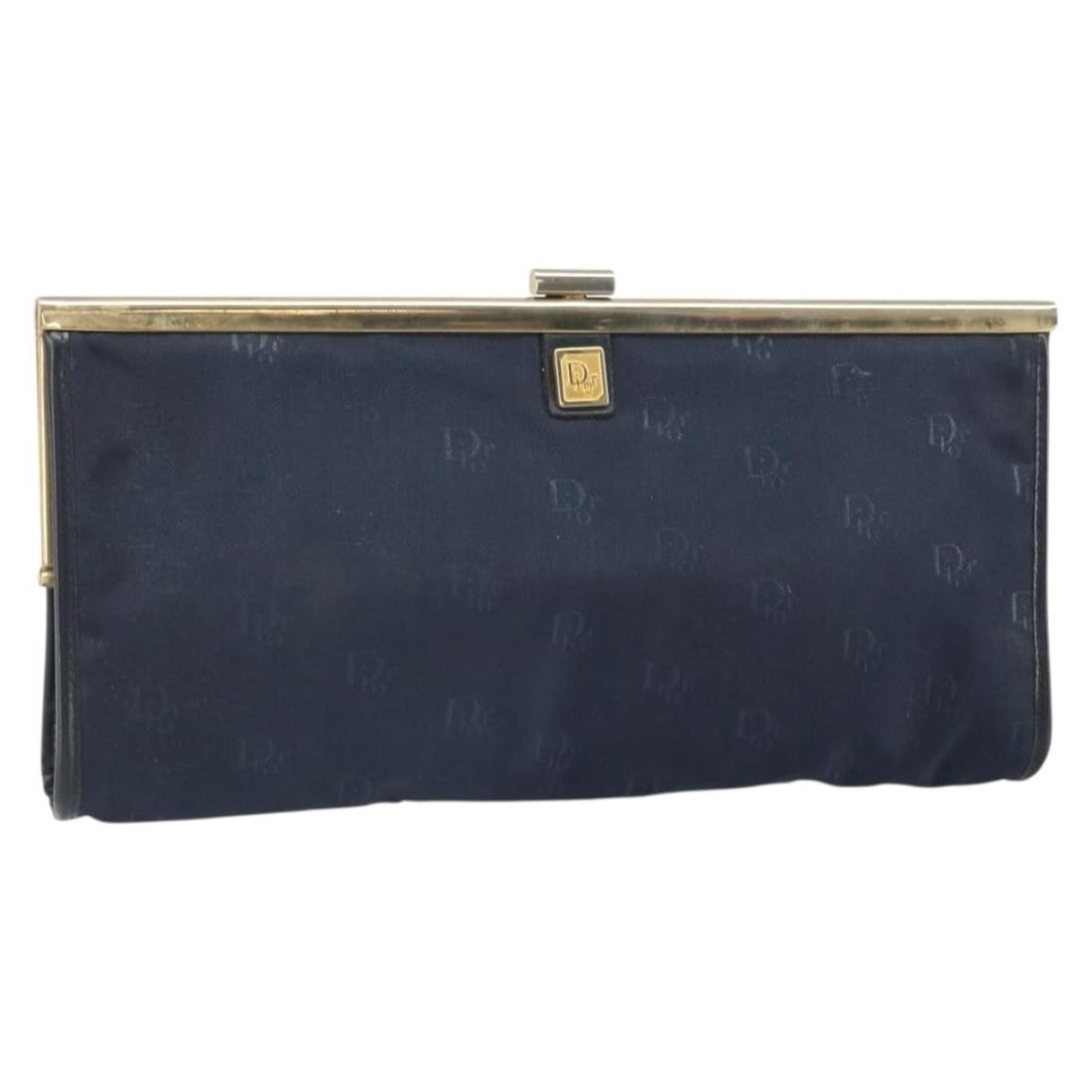 Navy and Gold Canvas Clutch by Christian Dior France: Navy and Gold Canvas Clutch by Christian Dior France This Christian Dior clutch bag features a navy and gold canvas exterior. Made in France, the bag is designed with a compact silhouette and includes
