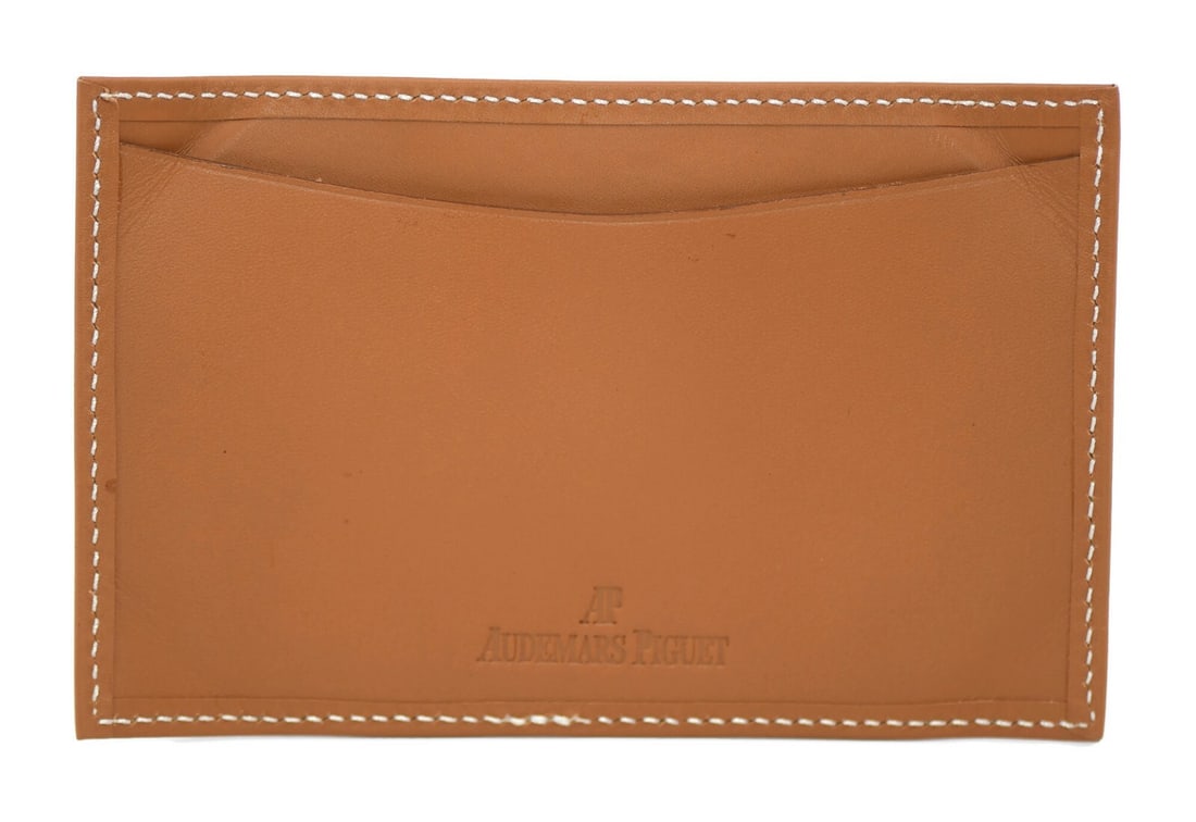 Audemars Piguet Authentic Brown Leather Wallet 6x4 Inches: Audemars Piguet Authentic Brown Leather Wallet 6x4 Inches This Audemars Piguet wallet showcases a rich brown color and is crafted with precision, reflecting the brand's luxurious reputation. Measuring