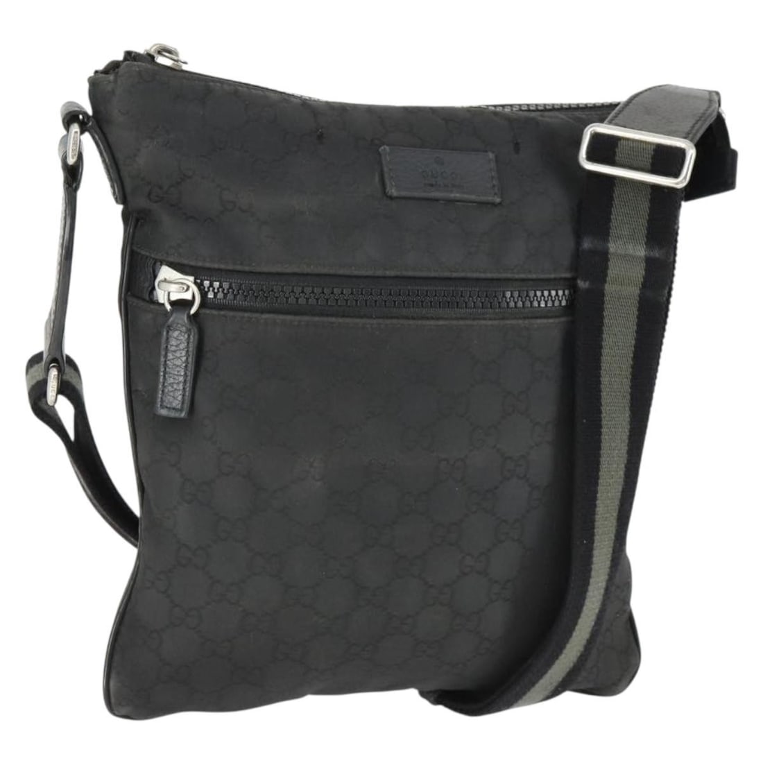 Black Nylon GG Canvas Shoulder Bag by Gucci Model 449184: Black Nylon GG Canvas Shoulder Bag by Gucci Model 449184 This GUCCI GG Canvas shoulder bag features a black and silver color scheme with a nylon and GG canvas exterior. Made in Italy, the bag offers a