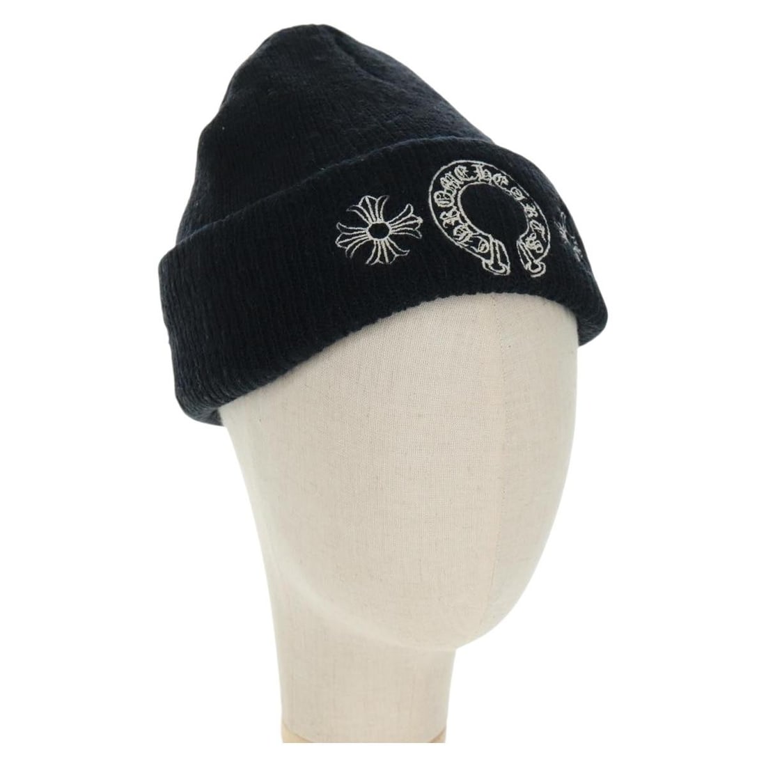 Black Wool Hat by Chrome Hearts Made in USA: Black Wool Hat by Chrome Hearts Made in USA This Chrome Hearts wool cap features a knitted fabric construction in black. Made in the USA, the hat shows signs of heavy use, including rubbing, slight lo