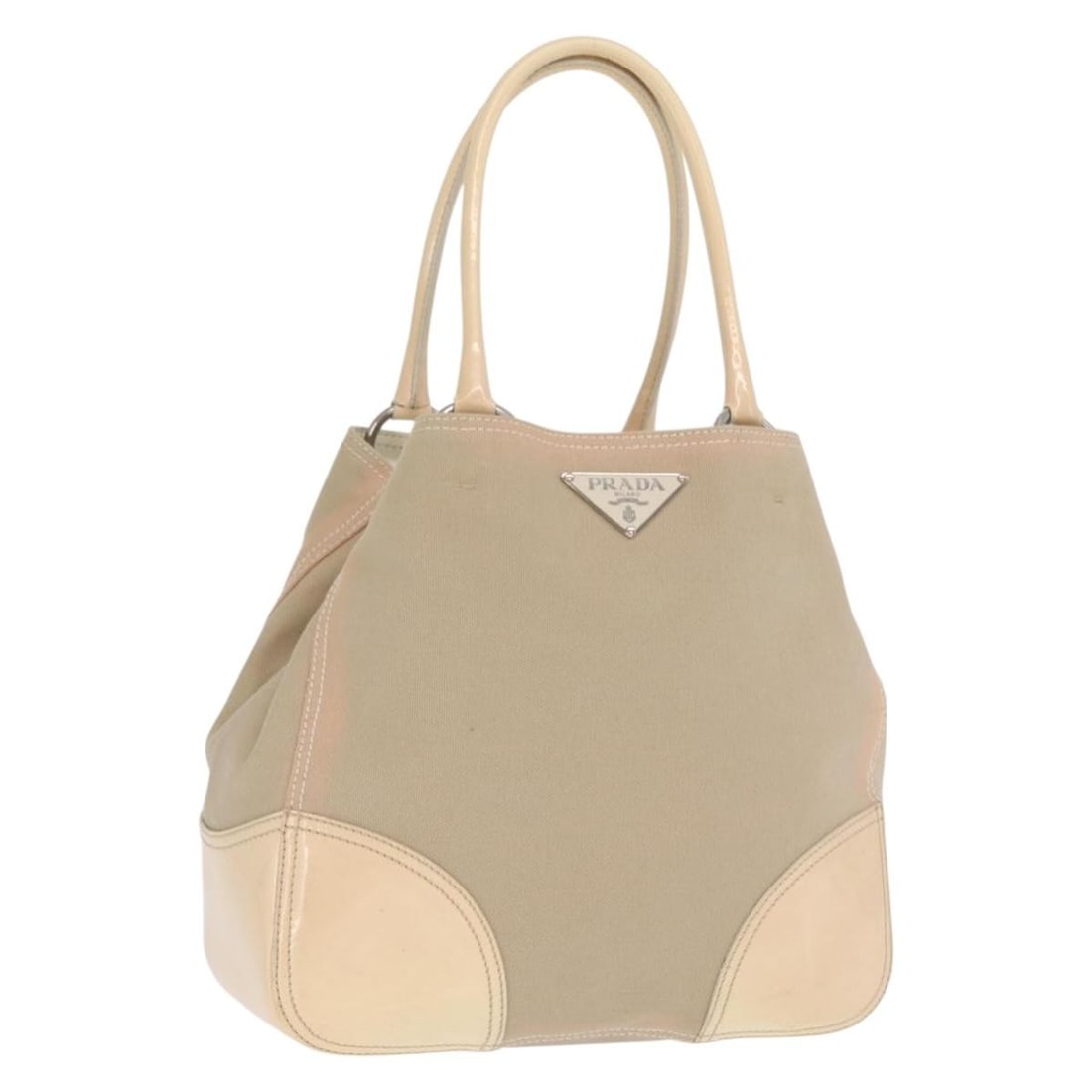 Prada Beige and Silver Canvas Leather Tote Bag from Italy: Prada Beige and Silver Canvas Leather Tote Bag from Italy This PRADA tote bag features a beige and silver canvas exterior with leather accents. The bag is made in Italy and is designed for everyday us