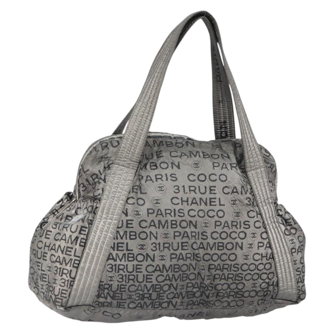 Silver Nylon Unlimited Tote from Chanel with CC Logo: Silver Nylon Unlimited Tote from Chanel with CC Logo This CHANEL Unlimited tote bag is crafted from silver nylon and features the signature CC logo. Made in Italy, it offers a spacious interior and co