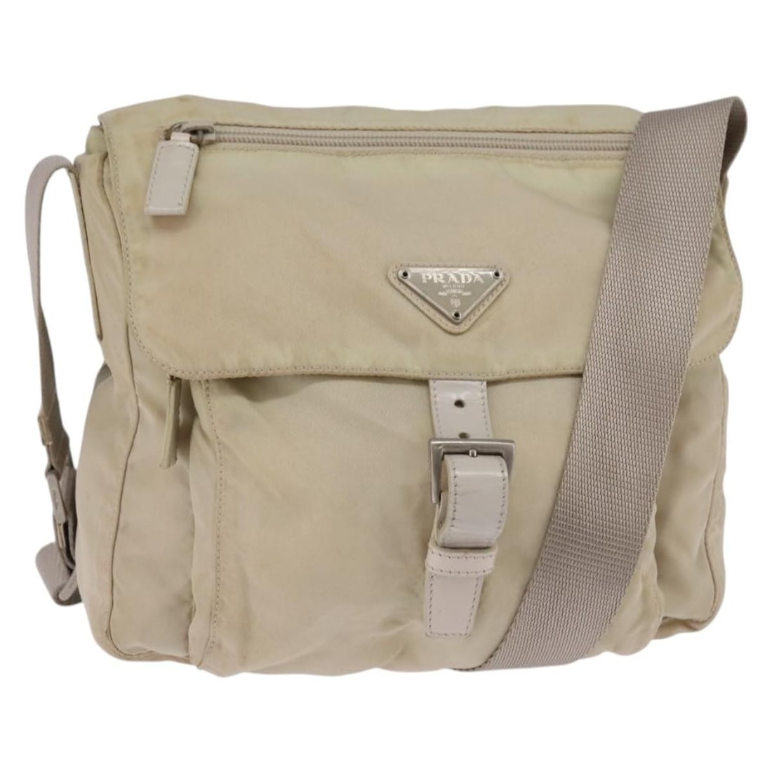Authentic PRADA Ivory Nylon Shoulder Bag with Adjustable Strap: Authentic PRADA Ivory Nylon Shoulder Bag with Adjustable Strap This authentic PRADA shoulder bag is crafted from durable nylon in a sophisticated ivory color. The bag features a spacious interior suit
