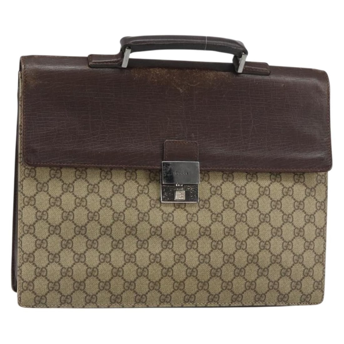 Beige PVC GG Supreme 34044 Business Bag by Gucci Italy: Beige PVC GG Supreme 34044 Business Bag by Gucci Italy This Gucci GG Supreme business bag is crafted from beige PVC leather and GG canvas, made in Italy. The bag features a structured silhouette with