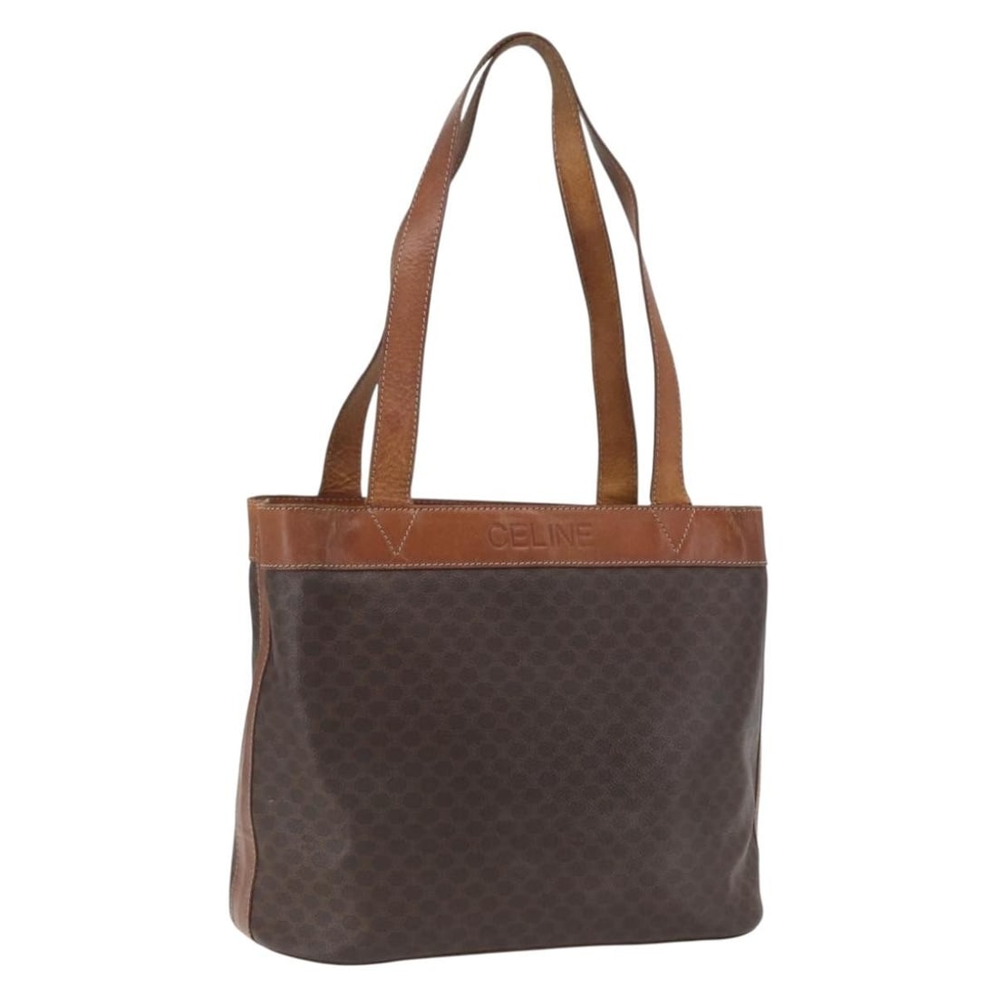 Celine Macadam Brown Tote Bag in PVC Leather with Gold Accents: Celine Macadam Brown Tote Bag in PVC Leather with Gold Accents This CELINE Macadam canvas tote bag features a brown and gold color scheme with PVC leather and canvas construction. Made in Italy, the b