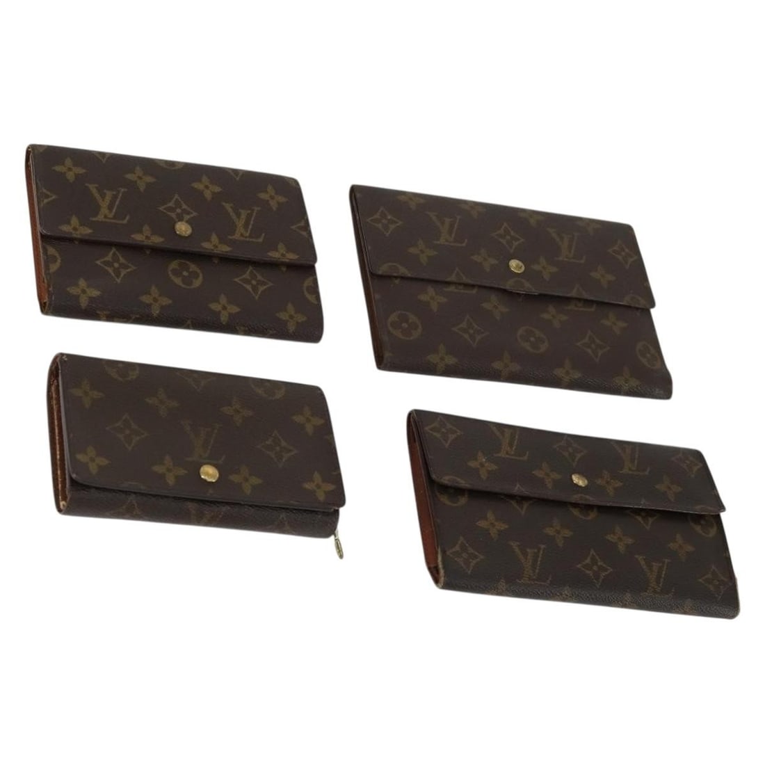 Set of 4 Monogram Canvas Wallets by Louis Vuitton: Set of 4 Monogram Canvas Wallets by Louis Vuitton This set includes four Louis Vuitton Monogram Canvas wallets, each featuring the signature monogram pattern. All items are made in France and crafted