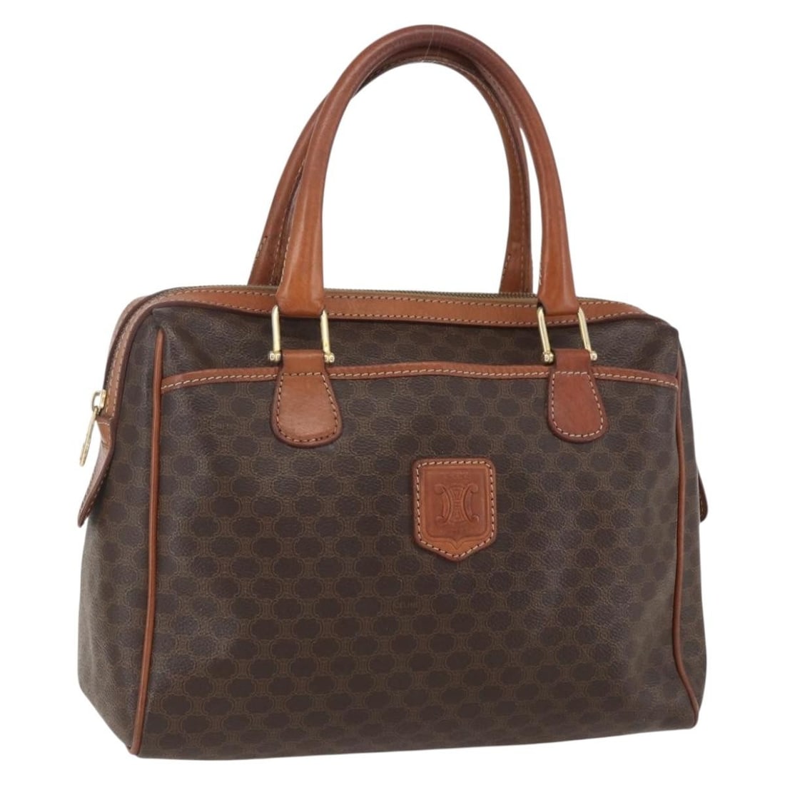 Brown PVC Macadam Canvas Celine Handbag with Gold Tone Accents: Brown PVC Macadam Canvas Celine Handbag with Gold Tone Accents This CELINE Macadam handbag features a brown and gold exterior crafted from PVC leather and signature Macadam canvas. The bag is made in