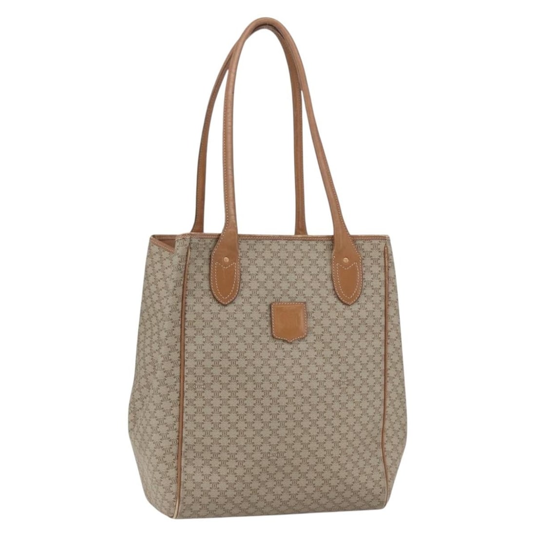 Beige PVC Macadam Canvas Tote by CELINE with Gold Accents: Beige PVC Macadam Canvas Tote by CELINE with Gold Accents This CELINE Macadam tote bag is crafted from beige and gold PVC leather with the iconic Macadam canvas. It features a spacious interior, dual