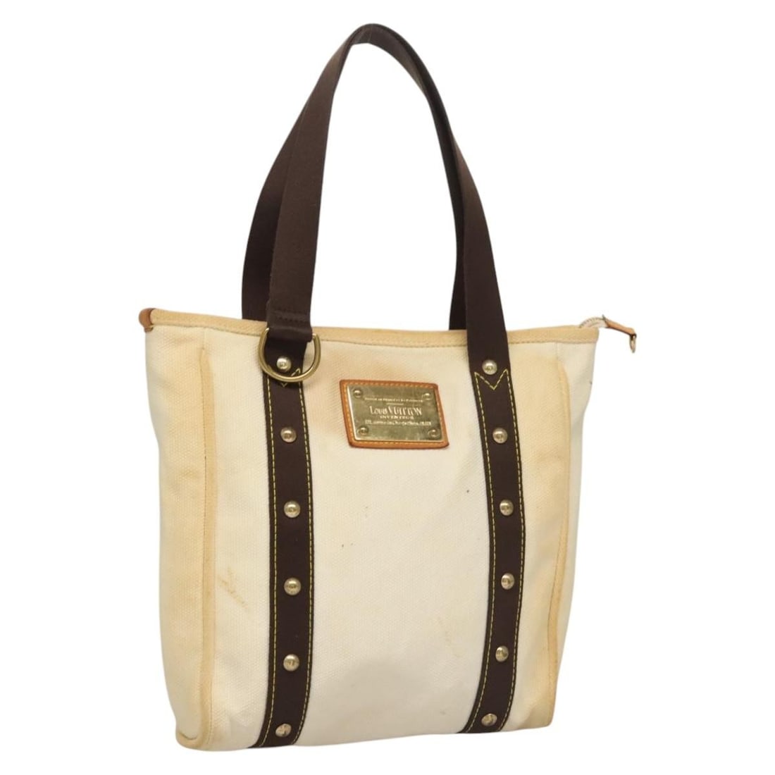 Louis Vuitton Antigua Cabas PM White Brown Canvas Tote M40036 France: Louis Vuitton Antigua Cabas PM White Brown Canvas Tote M40036 France This is a Louis Vuitton Antigua Cabas PM tote bag crafted from white and brown canvas. The bag features a spacious interior and stu