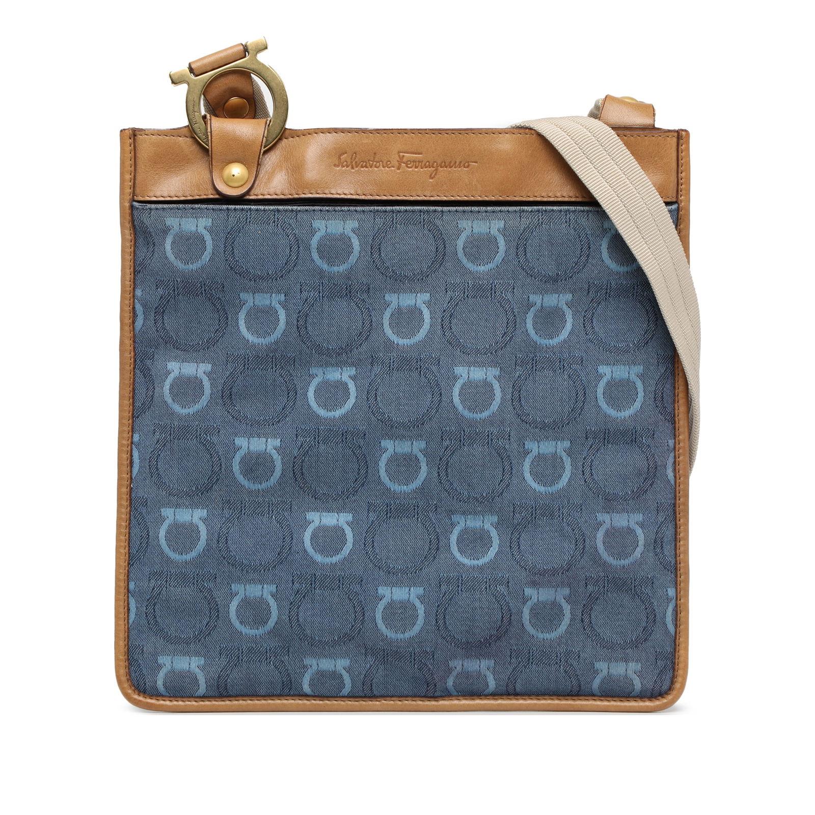 Ferragamo Gancini Crossbody Bag Blue Canvas Leather Trim: Ferragamo Gancini Crossbody Bag Blue Canvas Leather Trim Discover the elegance of the Ferragamo Gancini Canvas Crossbody, crafted with a durable canvas body complemented by luxurious leather trim. Thi