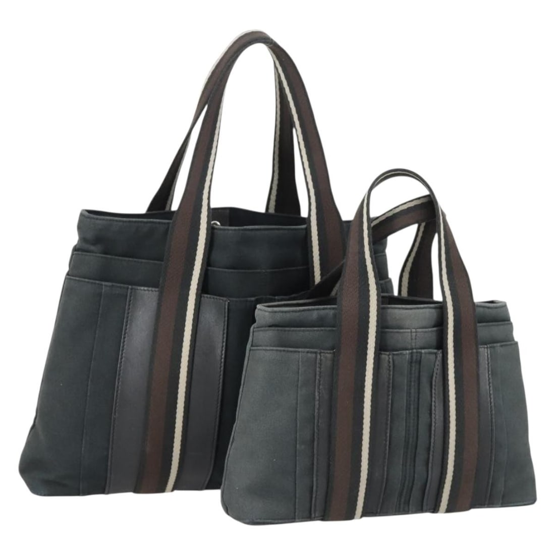 Set of 2 Hermes Trocha Canvas Tote Bags in Gray and Black: Set of 2 Hermes Trocha Canvas Tote Bags in Gray and Black This is a set of two Hermes Trocha Horizontal tote bags made from canvas in gray and black. Crafted in France, both bags feature a tote style