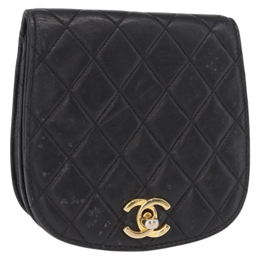 Black Lambskin Pouch with Gold CC Logo by Chanel: Black Lambskin Pouch with Gold CC Logo by Chanel This is a CHANEL pouch crafted from black and gold lambskin leather. The compact accessory features a CC logo and is made in Italy. The pouch shows sig