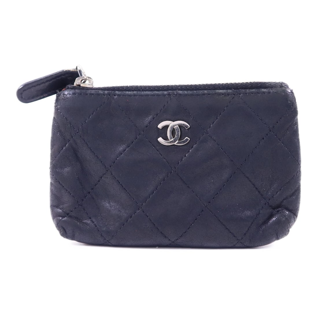 Black Lambskin Coin Purse by CHANEL with Silver Tone CC Logo: Black Lambskin Coin Purse by CHANEL with Silver Tone CC Logo This CHANEL coin case is crafted from black lambskin leather and features silver-tone hardware. Designed as a compact coin purse, it offers