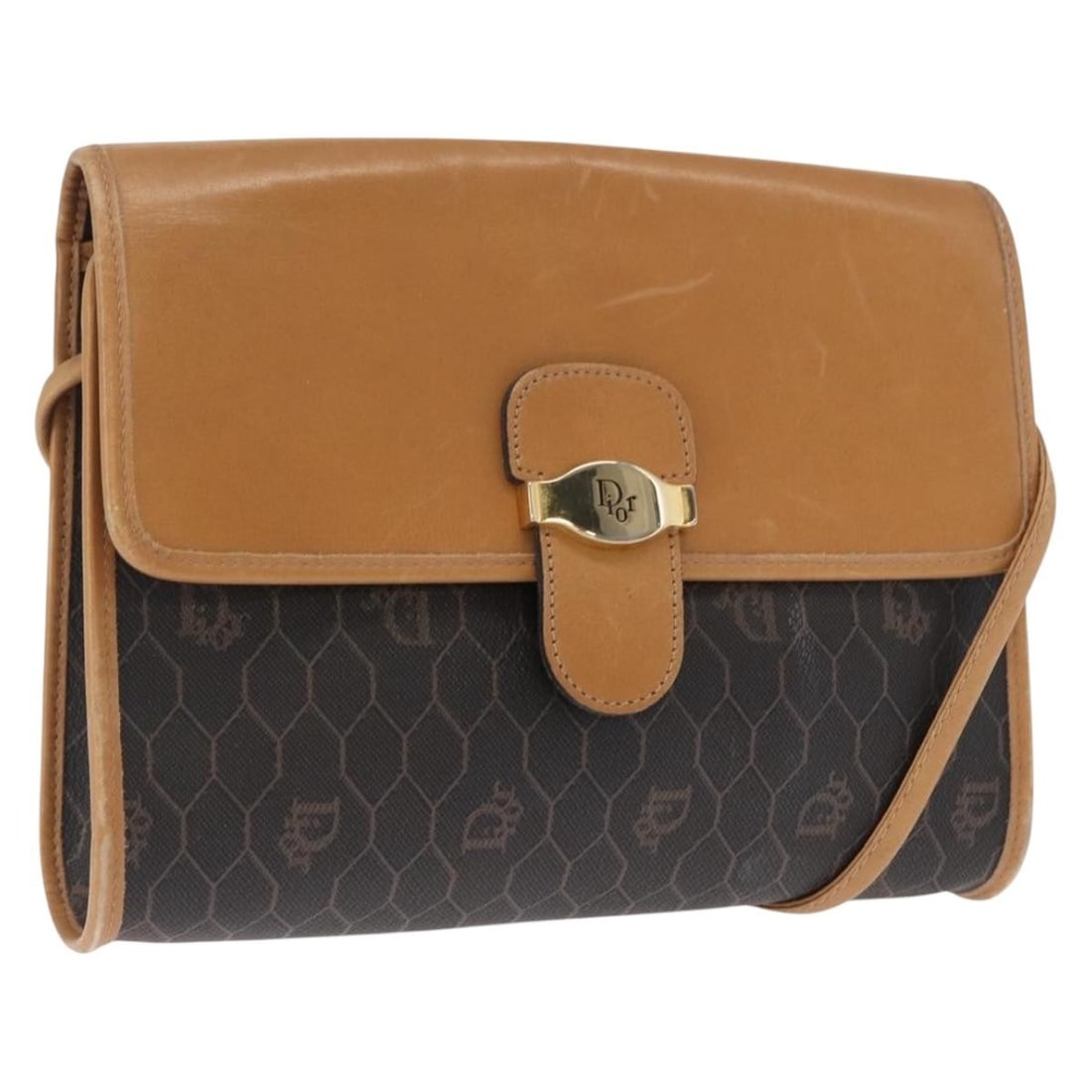 Black Honeycomb Canvas Christian Dior Shoulder Bag with Gold Accents: Black Honeycomb Canvas Christian Dior Shoulder Bag with Gold Accents This is a Christian Dior shoulder bag crafted from signature honeycomb canvas in black and gold tones. The bag features a compact d