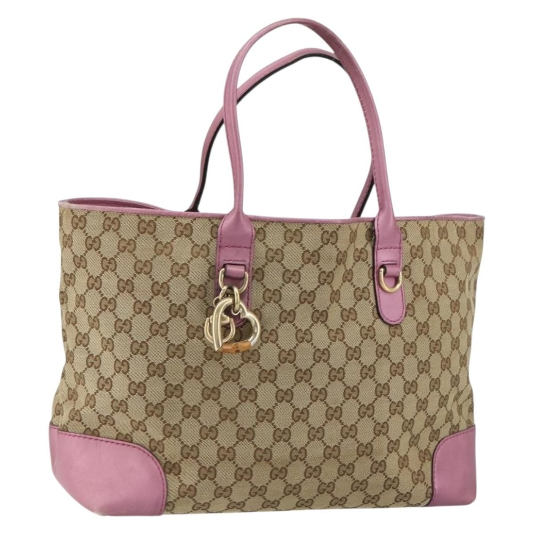 Beige Gold GG Canvas Heart Bit Tote by Gucci Model 269956: Beige Gold GG Canvas Heart Bit Tote by Gucci Model 269956 This is a Gucci GG Canvas Heart Bit tote bag in beige and gold, crafted in Italy. The bag features the iconic GG canvas exterior with gold-ton