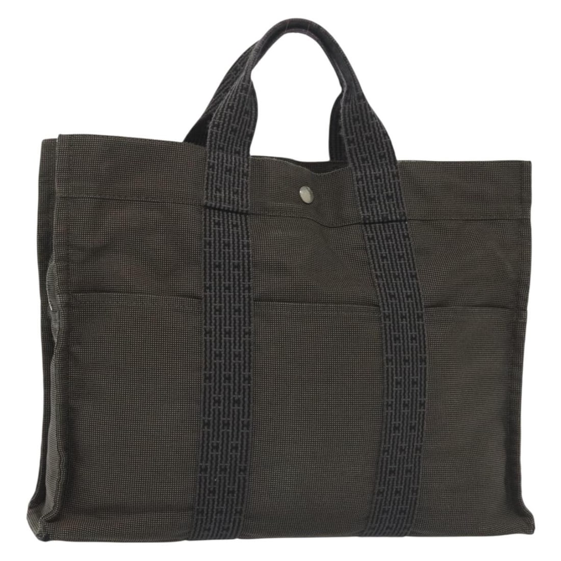 HERMES Fourre Tout MM Gray Canvas Hand Bag Made in France: HERMES Fourre Tout MM Gray Canvas Hand Bag Made in France This authentic HERMES Fourre Tout MM Hand Bag is a stylish and functional accessory made from durable gray canvas. Measuring approximately 16.