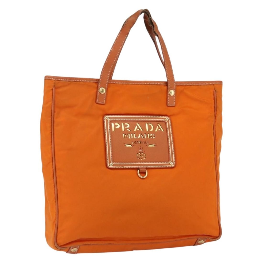 Orange Nylon Leather Prada Tote Bag Gold Tone Hardware Italy: Orange Nylon Leather Prada Tote Bag Gold Tone Hardware Italy This PRADA tote bag features orange nylon with gold-tone accents and leather trim. Made in Italy, it provides a spacious interior and pract