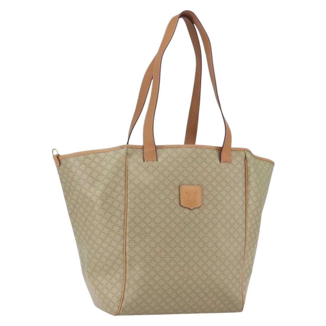 Celine Macadam Beige PVC Tote with Gold Accents: Celine Macadam Beige PVC Tote with Gold Accents This CELINE tote bag features the signature Macadam canvas with PVC leather accents in beige and gold tones. Made in Italy, the bag offers a spacious in