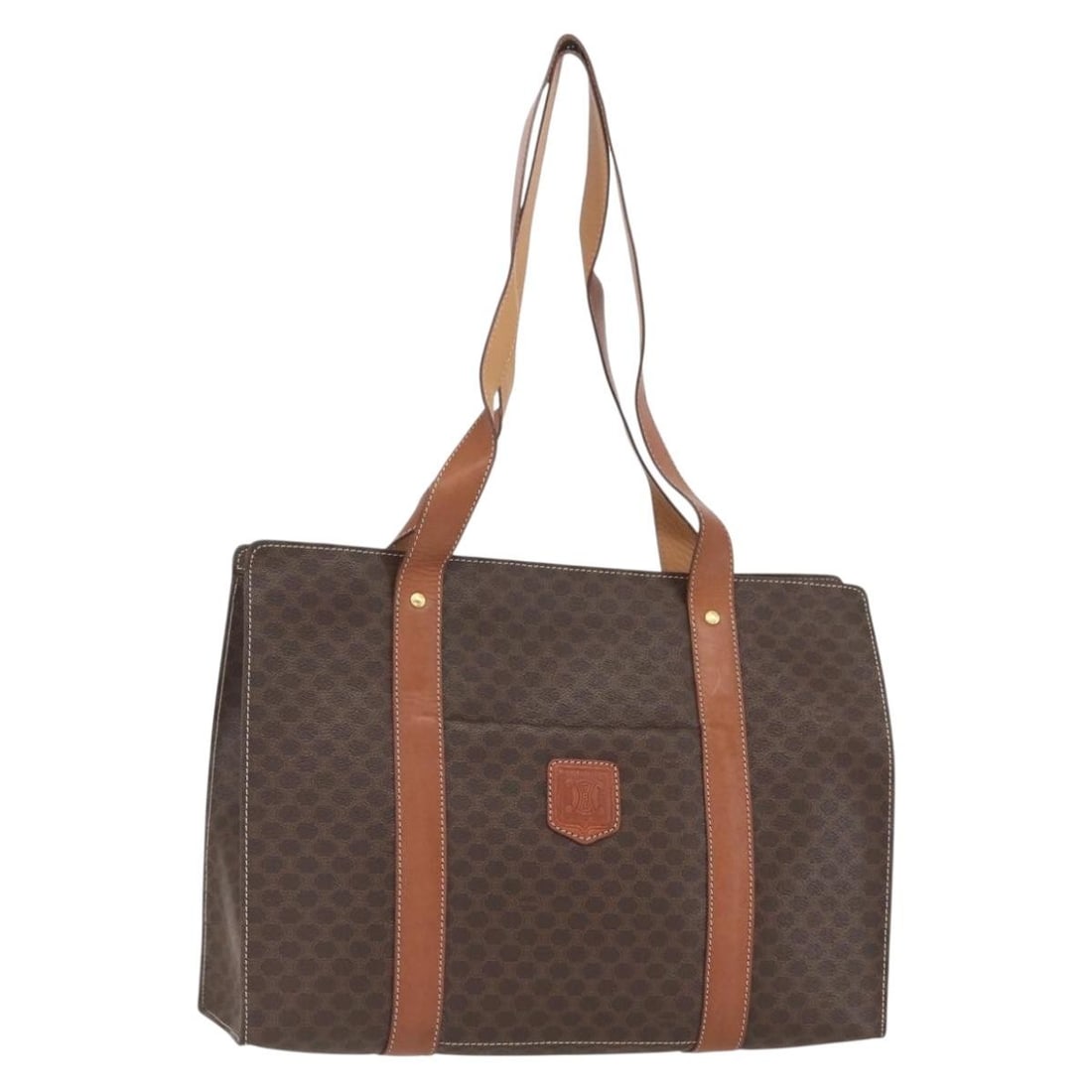 CELINE Beige Macadam PVC Tote Bag with Gold Accents: CELINE Beige Macadam PVC Tote Bag with Gold Accents This CELINE Macadam Canvas tote bag features a beige and gold color scheme with PVC leather and signature Macadam canvas construction. The bag is ma