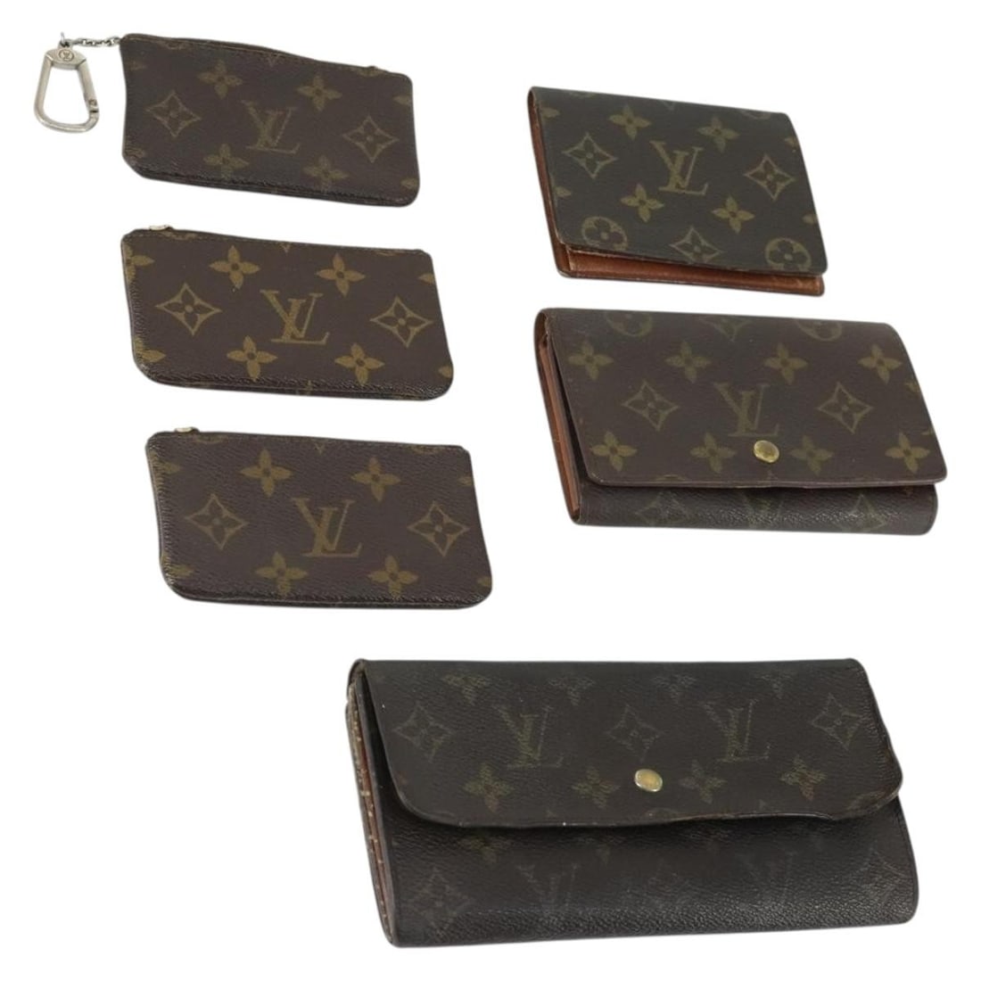 Set of 5 Louis Vuitton Monogram Canvas Wallets: Set of 5 Louis Vuitton Monogram Canvas Wallets This is a set of five Louis Vuitton wallets crafted from signature Monogram Canvas. The set originates from France and features a classic monogram color.