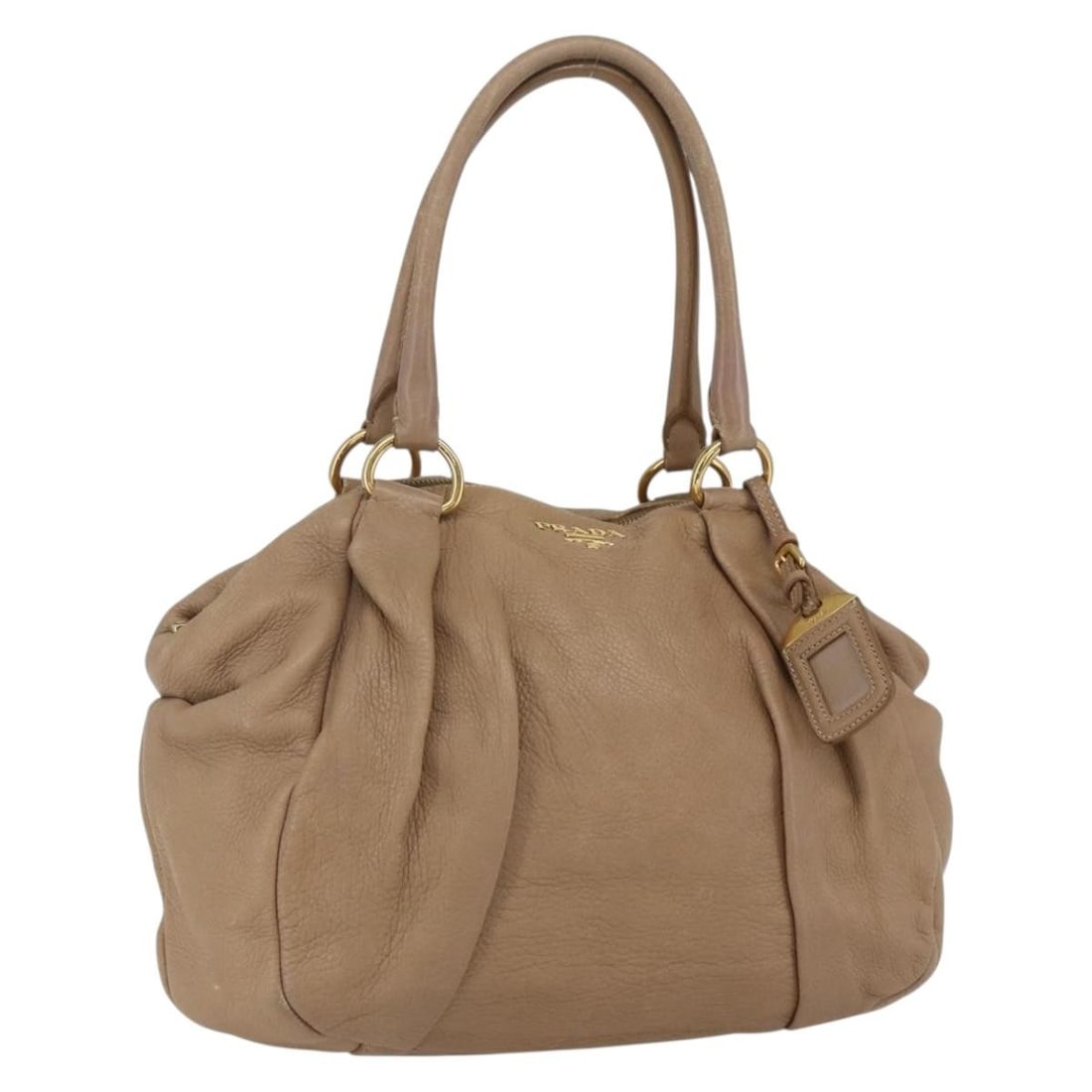 Prada Beige and Gold Leather Handbag with Name Tag: Prada Beige and Gold Leather Handbag with Name Tag This PRADA hand bag features a beige and gold leather exterior, offering a stylish and timeless look. Designed with practicality in mind, it provides