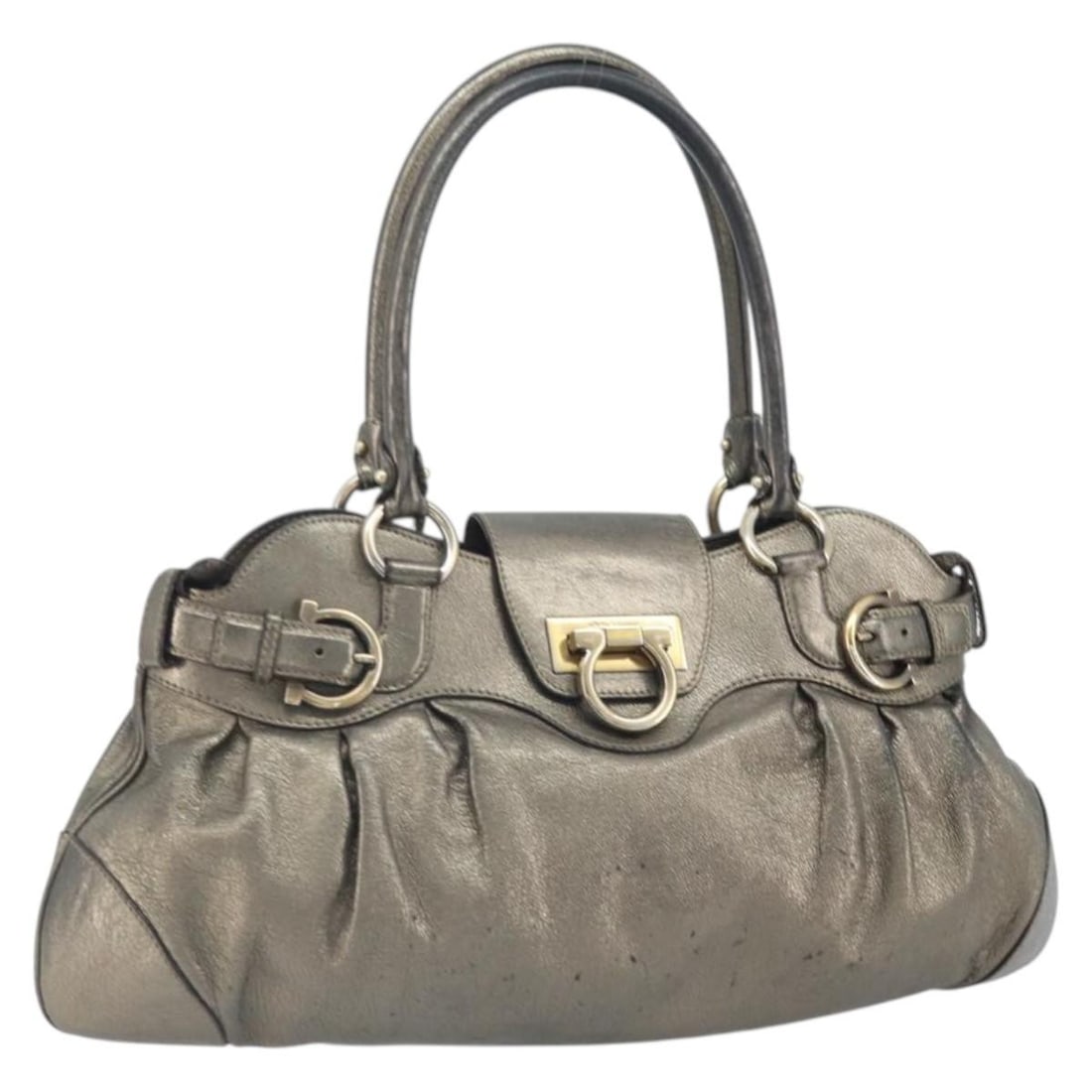 Gancini Leather Tote by Salvatore Ferragamo in Gold Made in Italy: Gancini Leather Tote by Salvatore Ferragamo in Gold Made in Italy This Salvatore Ferragamo Gancini handbag features gold leather with a structured silhouette. The bag includes dual handles with an app