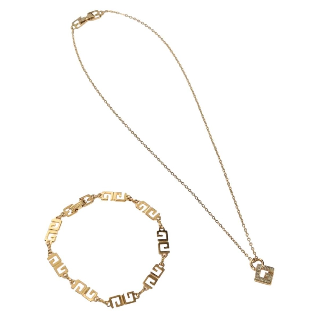 Gold Metal Necklace Two Piece Bundle by Givenchy: Gold Metal Necklace Two Piece Bundle by Givenchy This set includes two Givenchy necklaces crafted from gold-colored metal. Both pieces feature a stylish design and are offered as a special bundle. The