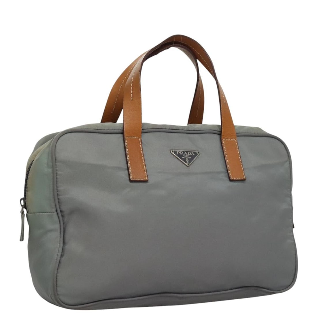 Authentic PRADA Gray Nylon Hand Bag Italy BD1037: Authentic PRADA Gray Nylon Hand Bag Italy BD1037 This PRADA Hand Bag combines style and functionality with its durable gray nylon exterior. Measuring approximately 11.4 inches in length, 7.5 inches in