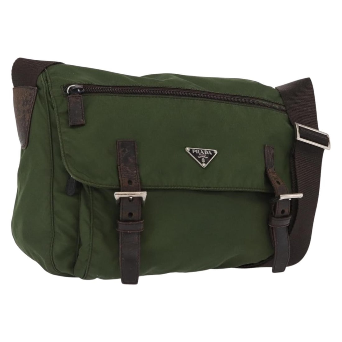 Prada Khaki Nylon Shoulder Bag with Silver Accents Italy: Prada Khaki Nylon Shoulder Bag with Silver Accents Italy This PRADA shoulder bag is crafted from khaki nylon with silver-tone details and features an adjustable shoulder strap. The bag is made in Ital