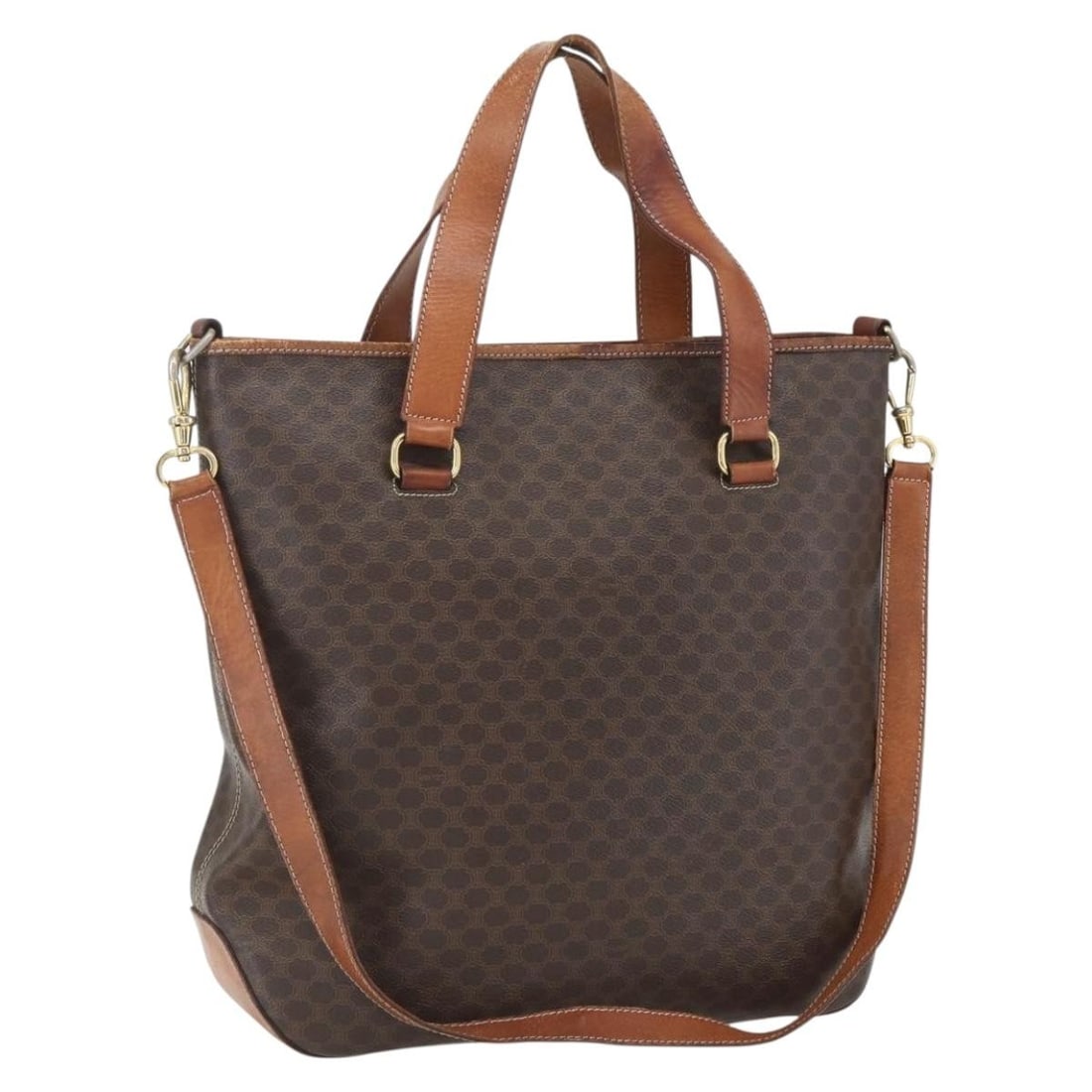 Celine Macadam Brown PVC Tote Shoulder Bag with Gold Tone Accents and Strap: Celine Macadam Brown PVC Tote Shoulder Bag with Gold Tone Accents and Strap This Celine Macadam tote bag features a brown and gold color scheme and is crafted from PVC leather and Macadam canvas. The