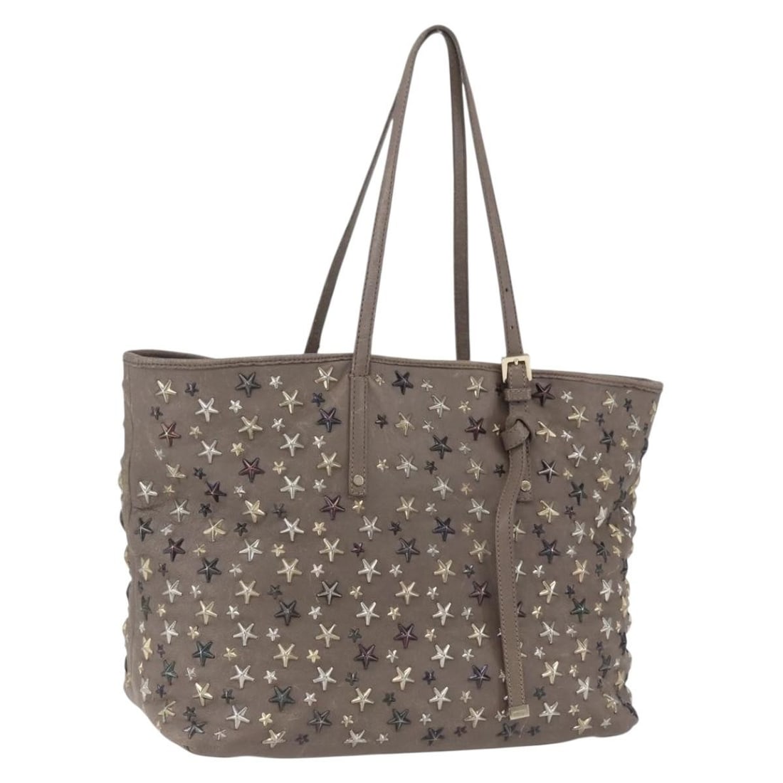 Beige Leather Tote with Stud Accents by Jimmy Choo: Beige Leather Tote with Stud Accents by Jimmy Choo This Jimmy Choo tote bag features beige leather with stud accents. Made in Italy, it offers a spacious interior and a comfortable handle drop. The ba