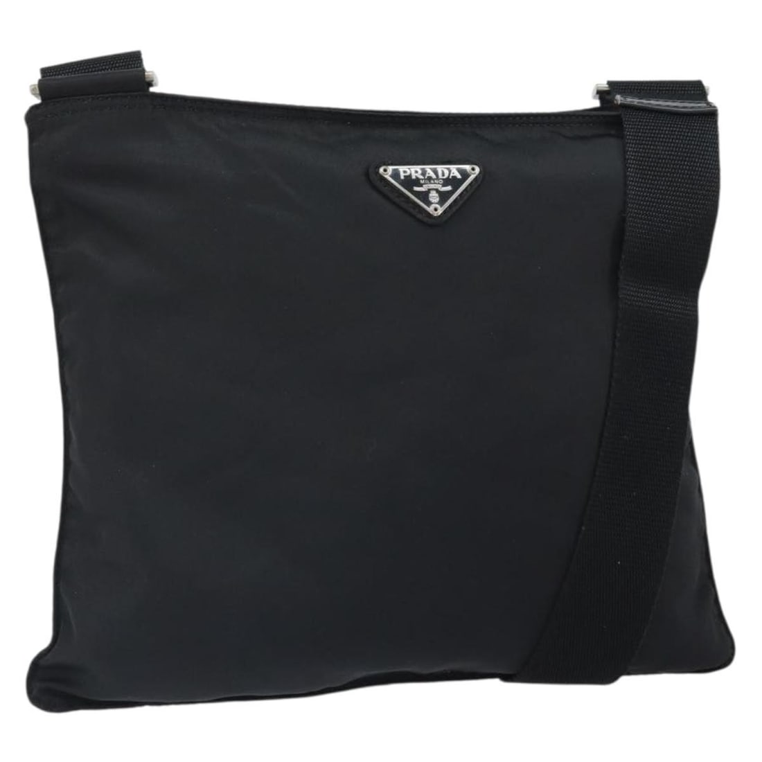 Prada Black Nylon Shoulder Bag with Silver Details Made in Italy: Prada Black Nylon Shoulder Bag with Silver Details Made in Italy This PRADA shoulder bag is crafted from durable black nylon with silver-tone accents. Designed for everyday use, it features a spacious